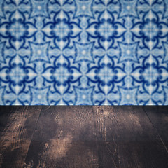 Image showing Wood table top and blur vintage ceramic tile pattern wall