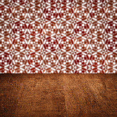 Image showing Wood table top and blur vintage ceramic tile pattern wall