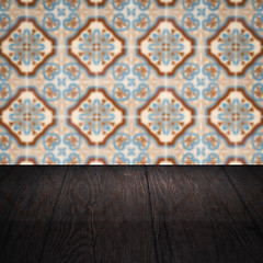 Image showing Wood table top and blur vintage ceramic tile pattern wall