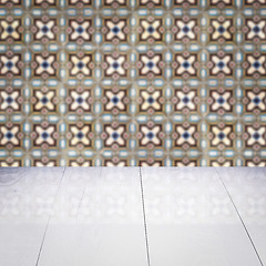 Image showing Wood table top and blur vintage ceramic tile pattern wall