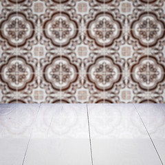 Image showing Wood table top and blur vintage ceramic tile pattern wall