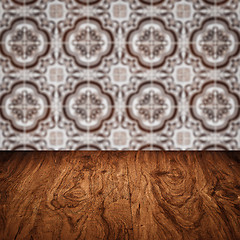 Image showing Wood table top and blur vintage ceramic tile pattern wall