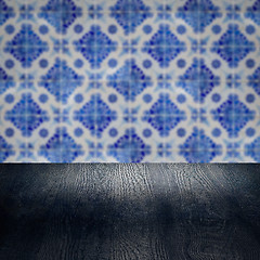 Image showing Wood table top and blur vintage ceramic tile pattern wall