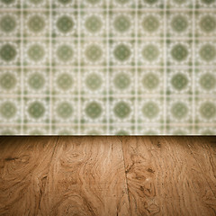 Image showing Wood table top and blur vintage ceramic tile pattern wall