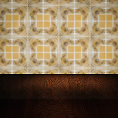 Image showing Wood table top and blur vintage ceramic tile pattern wall