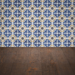 Image showing Wood table top and blur vintage ceramic tile pattern wall