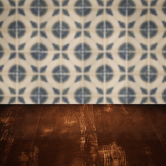 Image showing Wood table top and blur vintage ceramic tile pattern wall