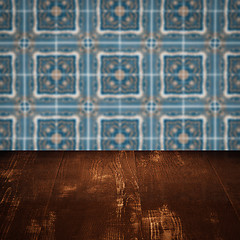 Image showing Wood table top and blur vintage ceramic tile pattern wall