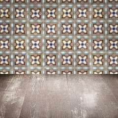 Image showing Wood table top and blur vintage ceramic tile pattern wall