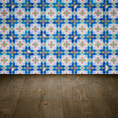 Image showing Wood table top and blur vintage ceramic tile pattern wall