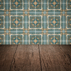 Image showing Wood table top and blur vintage ceramic tile pattern wall