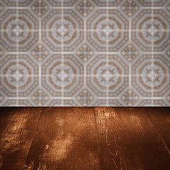 Image showing Wood table top and blur vintage ceramic tile pattern wall