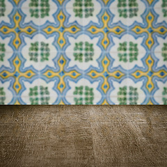 Image showing Wood table top and blur vintage ceramic tile pattern wall