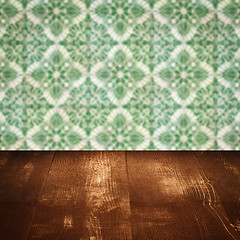 Image showing Wood table top and blur vintage ceramic tile pattern wall