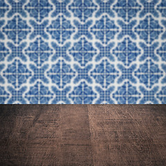 Image showing Wood table top and blur vintage ceramic tile pattern wall