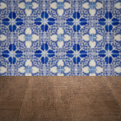 Image showing Wood table top and blur vintage ceramic tile pattern wall