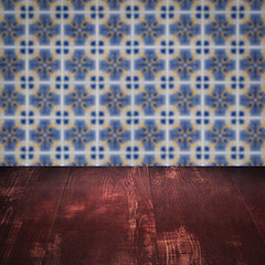 Image showing Wood table top and blur vintage ceramic tile pattern wall