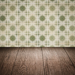 Image showing Wood table top and blur vintage ceramic tile pattern wall