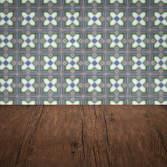 Image showing Wood table top and blur vintage ceramic tile pattern wall