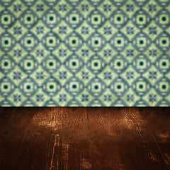 Image showing Wood table top and blur vintage ceramic tile pattern wall