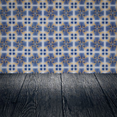 Image showing Wood table top and blur vintage ceramic tile pattern wall