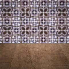 Image showing Wood table top and blur vintage ceramic tile pattern wall