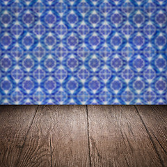 Image showing Wood table top and blur vintage ceramic tile pattern wall