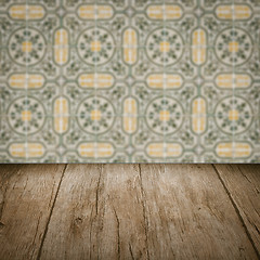 Image showing Wood table top and blur vintage ceramic tile pattern wall