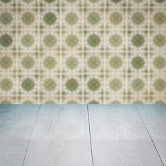 Image showing Wood table top and blur vintage ceramic tile pattern wall