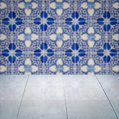 Image showing Wood table top and blur vintage ceramic tile pattern wall