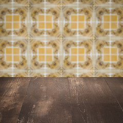 Image showing Wood table top and blur vintage ceramic tile pattern wall