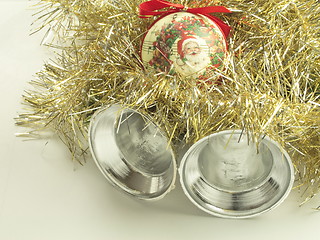 Image showing silver bells with a santa bauble and tinsel