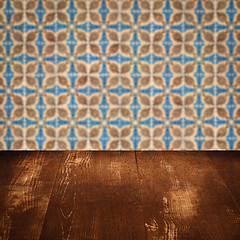 Image showing Wood table top and blur vintage ceramic tile pattern wall