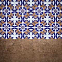 Image showing Wood table top and blur vintage ceramic tile pattern wall