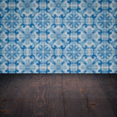 Image showing Wood table top and blur vintage ceramic tile pattern wall