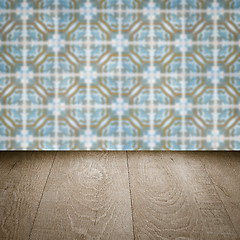 Image showing Wood table top and blur vintage ceramic tile pattern wall