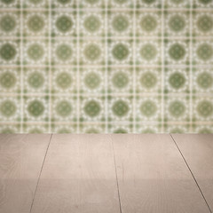 Image showing Wood table top and blur vintage ceramic tile pattern wall