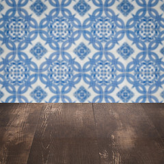 Image showing Wood table top and blur vintage ceramic tile pattern wall