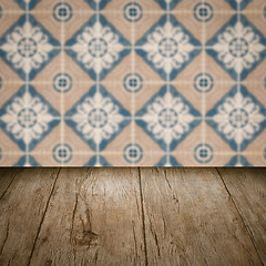 Image showing Wood table top and blur vintage ceramic tile pattern wall