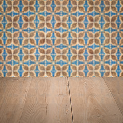 Image showing Wood table top and blur vintage ceramic tile pattern wall