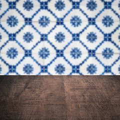 Image showing Wood table top and blur vintage ceramic tile pattern wall