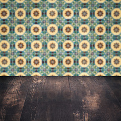 Image showing Wood table top and blur vintage ceramic tile pattern wall