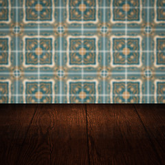 Image showing Wood table top and blur vintage ceramic tile pattern wall