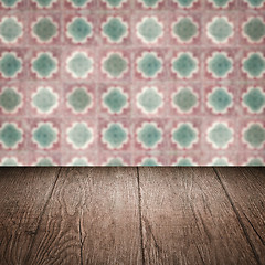 Image showing Wood table top and blur vintage ceramic tile pattern wall