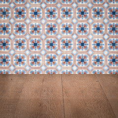 Image showing Wood table top and blur vintage ceramic tile pattern wall