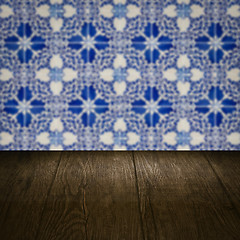 Image showing Wood table top and blur vintage ceramic tile pattern wall