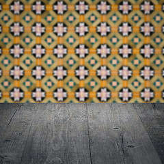 Image showing Wood table top and blur vintage ceramic tile pattern wall