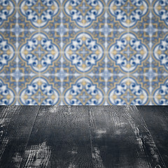 Image showing Wood table top and blur vintage ceramic tile pattern wall