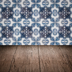 Image showing Wood table top and blur vintage ceramic tile pattern wall