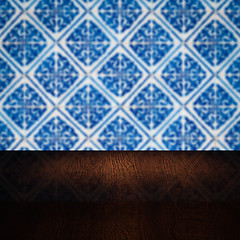 Image showing Wood table top and blur vintage ceramic tile pattern wall